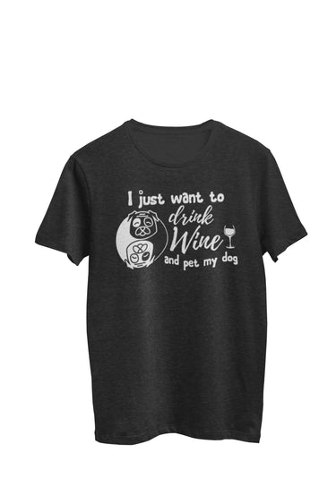 Heather black Unisex T-shirt featuring the text 'I just want to drink wine and pet my dog,' along with an endearing image of a dog nestled within a yin yang symbol, accompanied by a wine glass with a yin yang symbol on its stem. Designed by WooHoo Apparel